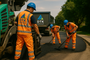 Workers from DTK Group completing surface restoration with paving equipment at the end of a civils project